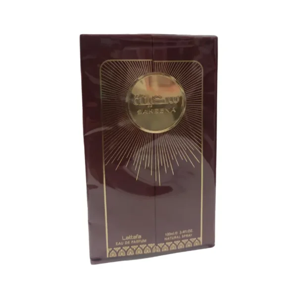 Perfume Lattafa Sakeena, frasco dorado con detalles orientales para mujer.